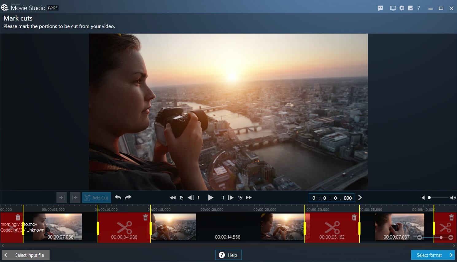 Woman editing sunrise video in Movie Studio software.