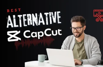 Smiling man using laptop with video editing software