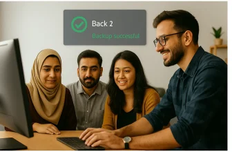 Group celebrating successful data backup on computer.